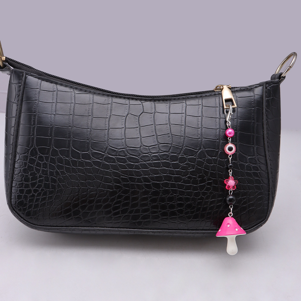 La versión coreana transfronteriza de la joyería de llavero de setas de color, la resina de dibujos animados, el ojo creativo del diablo, el bolso, el colgante de accesorios