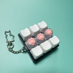 クロスボーダー猫 9 キー減圧キーボードプレスピンチ減圧キーキーホルダーおもちゃ