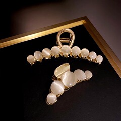 ヘアピンの半分の髪のカチューシャの大きいつかみの猫の目の石の新型の後頭部の髪の気質の真珠のクリップの頭飾りの女性