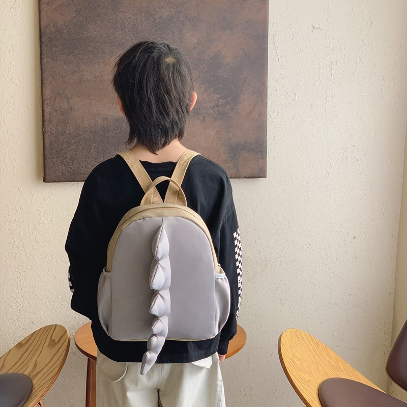 Mochila infantil transfronteriza de dibujos animados lindos dinosaurios cola mochila para niños y niñas jardín de infantes pequeña clase mochila para niños