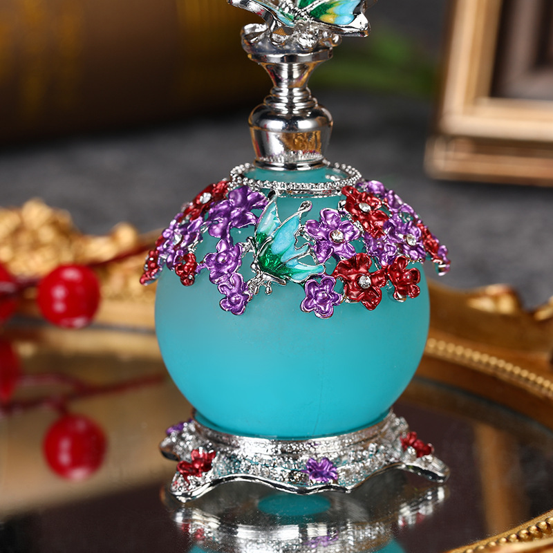 AliExpress Venta caliente mariposa 20ml botella de aceite de gran capacidad sub-embotellado botella de perfume de aleación de zinc botella de decoración al por mayor