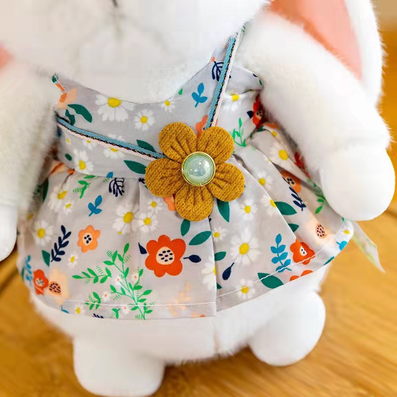 Nueva pastoral conejo muñeca de juguete lindo vestido la flor conejito agarrar máquina muñeca al por mayor