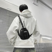 新款多功能对讲机三角胸包港风战术包手机包户外多功能便携式背包