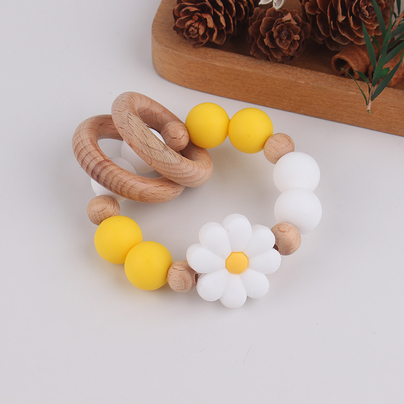 Nuevo juguete de mano para bebé con sonajero, los molares de los niños pueden morder el castaño de haya, margarita, pulsera de flores, mordedor