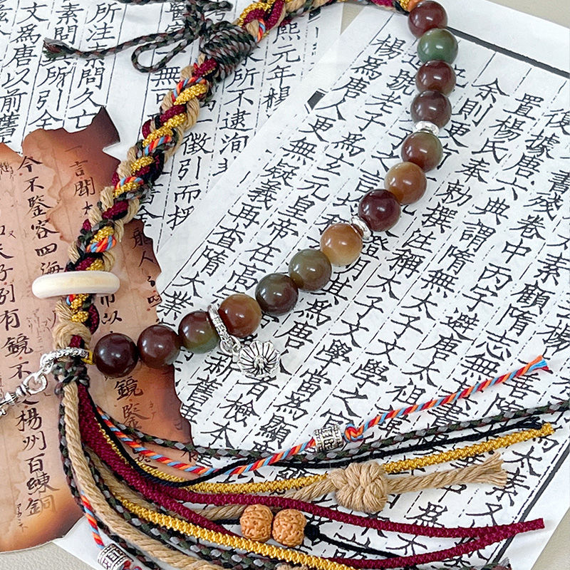 "Gesang" cordón tibetano tejido a mano de raíz de bodígan pequeño libro rojo pulsera nacional tejida productos terminados de venta caliente