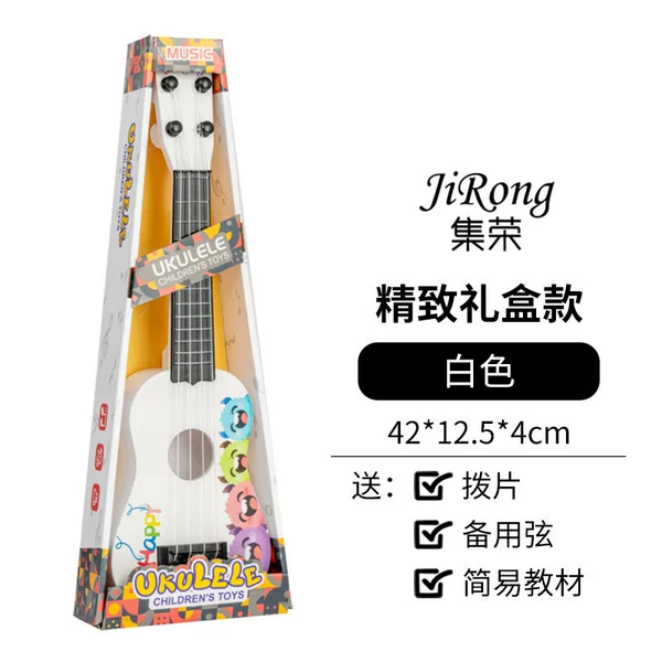 White ukulele with a score, toy with accessories