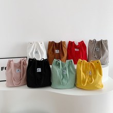 外贸款条绒单肩包水桶包新款文艺小清新女包学院风休闲大容量手提
