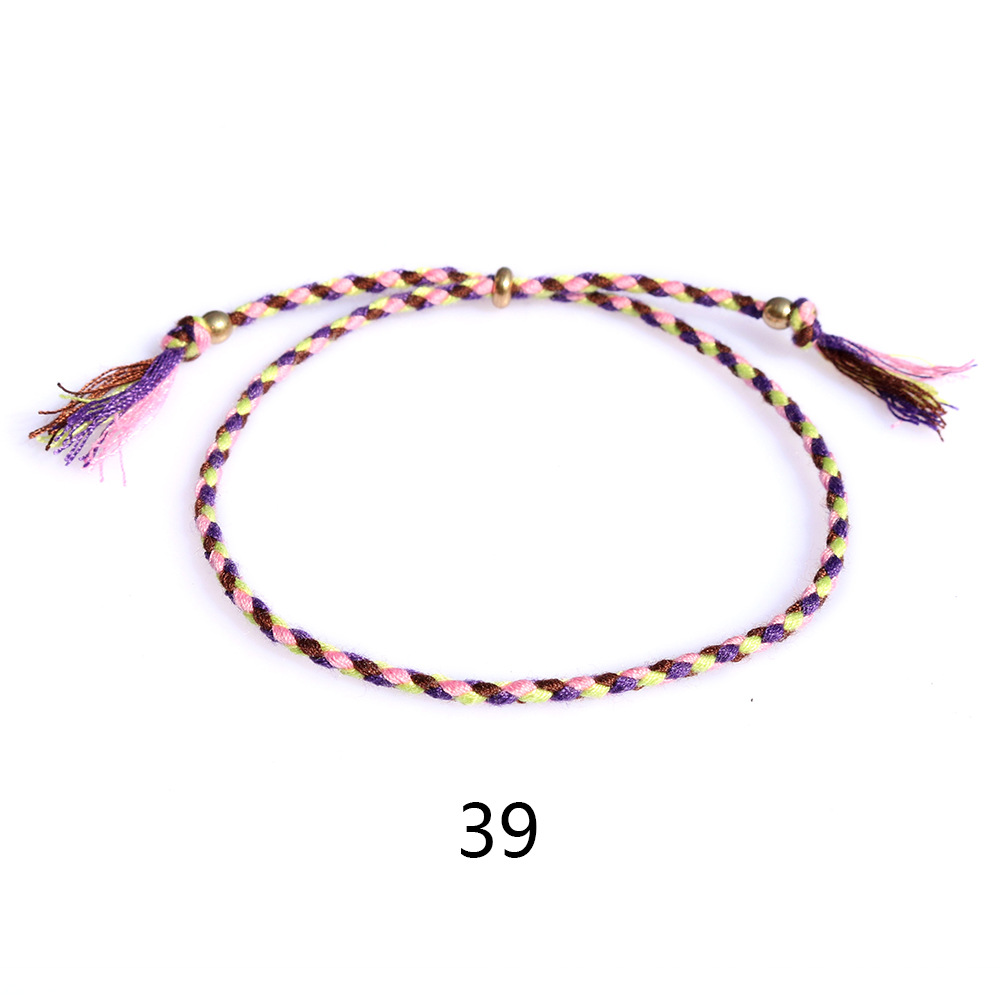 Amazon popular colorido cuerda de algodón amistad pulsera perlas de cobre borla pulsera tejida a mano ajustable hombres y mujeres pulsera