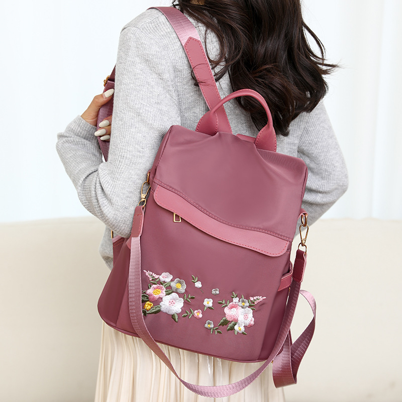 2024 nueva mochila antirrobo bordada para mujer estilo étnico moda flor ocio mochila de viaje de un solo hombro de doble uso