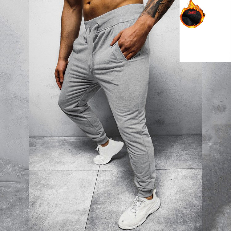 Cross-Border Pantalones deportivos cálidos para hombres Pantalones deportivos de moda casual forrados de lana para hombres Otoño e invierno pantalones cálidos Ventas de fábrica para hombres