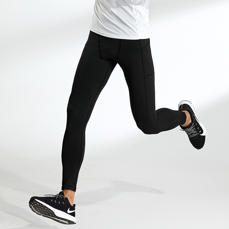 Europa y América nuevas medias deportivas de los hombres de secado rápido transpirable entrenamiento fitness pantalones corriendo baloncesto alto elástico polainas