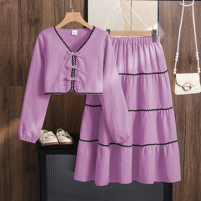 Ropa para niñas de comercio exterior europeo y americano, nueva colección primavera 2026, top de manga larga con lazo y falda de encaje para Amazon transfronterizo.