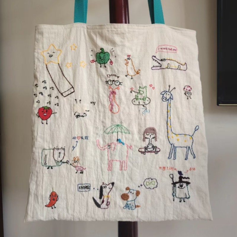 2025新款日式涂鸦刺绣帆布包文艺百搭松弛感单肩包通勤休闲手提包