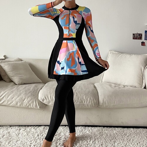 Muslim swimwear with random graphic prints: conservative, full-coverage three-piece set featuring long-sleeve one-piece tops and long pants with shorts.