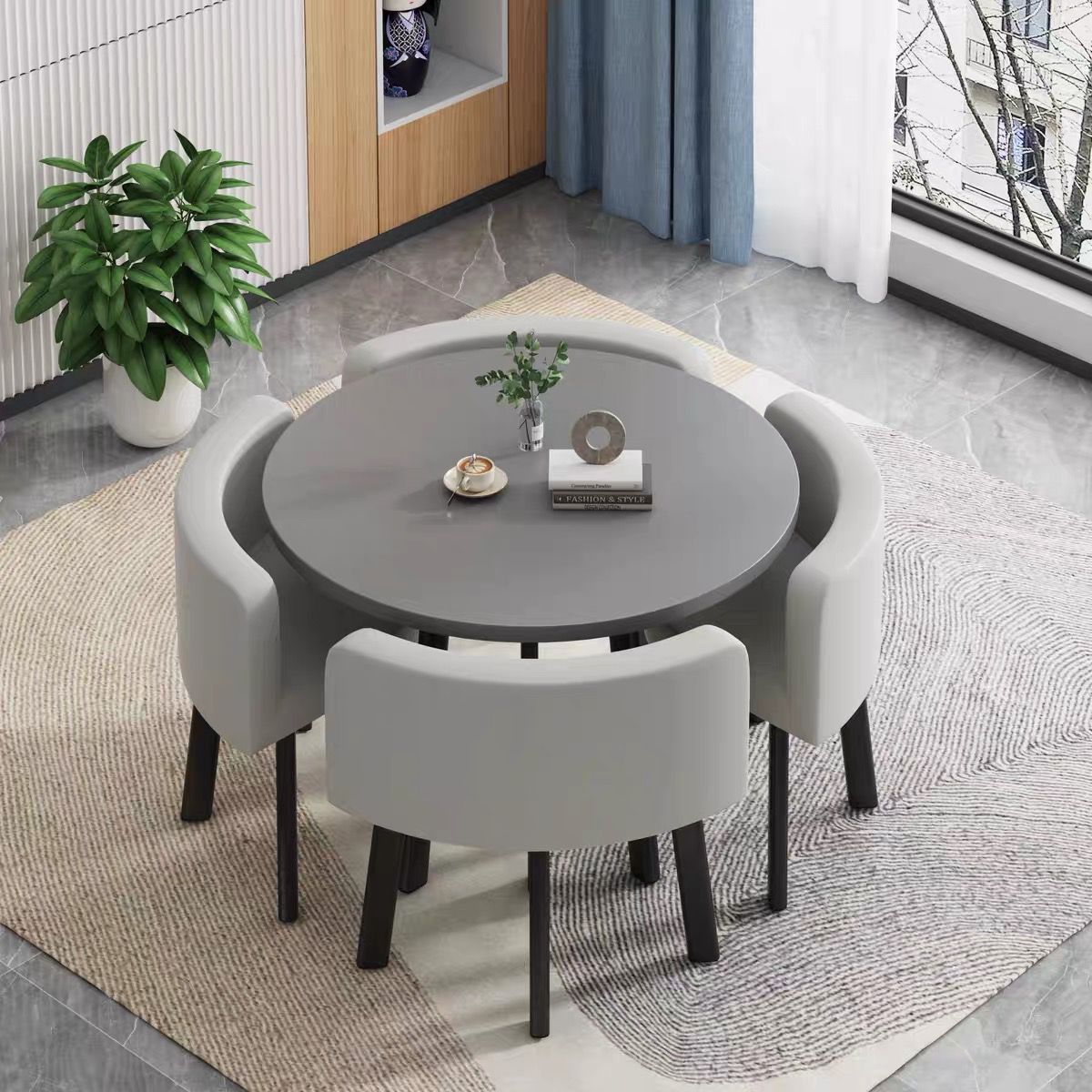 Gray round table + four chairs light gray leather chairs