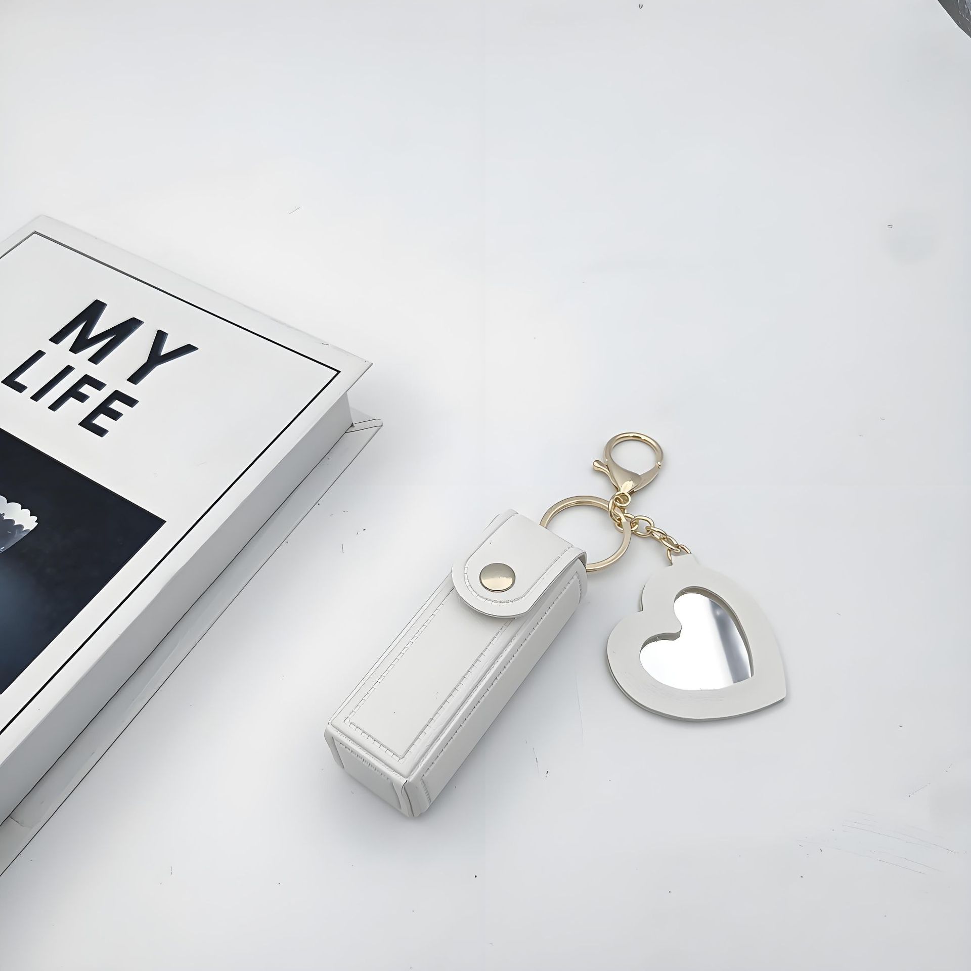 Bolso de cambio transfronterizo sobre rojo espejo creativo llavero colgante pequeño PU cuero bolso de coche accesorios accesorios en stock