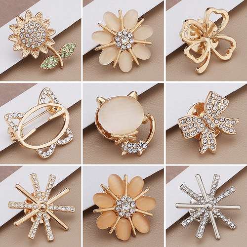 Wholesale anti-exposure buckle brooch, high-end bow, snowflake pin, small fragrance style decorative metal jewelry for clothing neckline