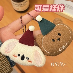 秋冬のかわいい萌えペットのぬいぐるみのペンダントの少女のキーホルダーのリュックサックの装飾はぶら下がっています。