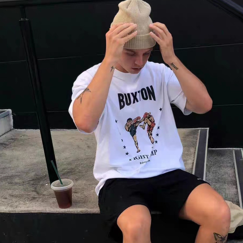 Nueva camiseta de verano para hombre con estampado de boxeo, estilo urbano, estilo vintage holgado, algodón puro, estilo para parejas, cuello redondo, manga corta.