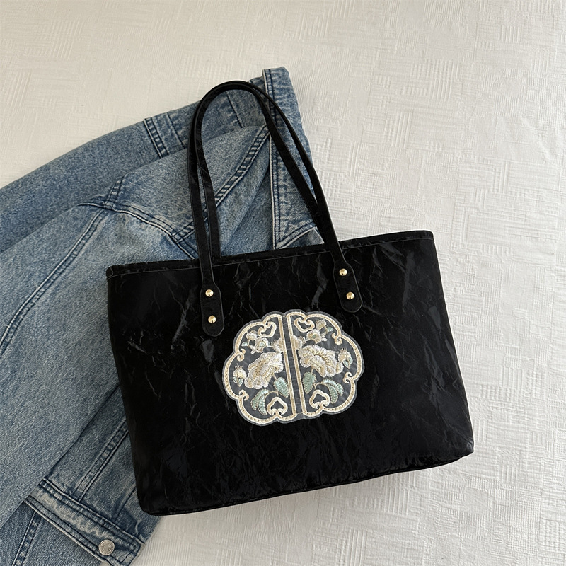 Bolsa de mano de alta calidad de alta capacidad de textura de transporte de verano 2024 nuevo estilo versátil para trabajar bolsas de hombro