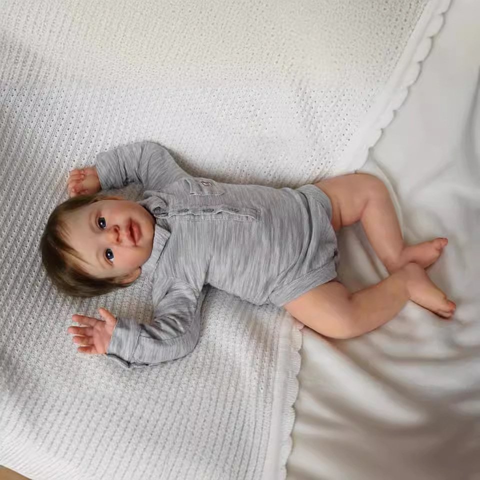 Cuerpo de tela de 22 pulgadas Anthony reborn muñeca simulación bebé suministro transfronterizo entrega de una sola pieza