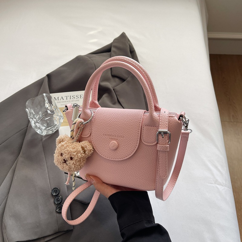 Bolsos pequeños de mano más vendidos de comercio exterior para mujer 2025 nuevo bolso cuadrado pequeño simple y todo fósforo textura casual bolso de mensajero de un solo hombro