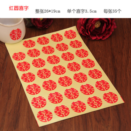 Wedding stickers with happy words on red envelopes and sugar box seals. Small happy words with glue on mini egg and apple cups