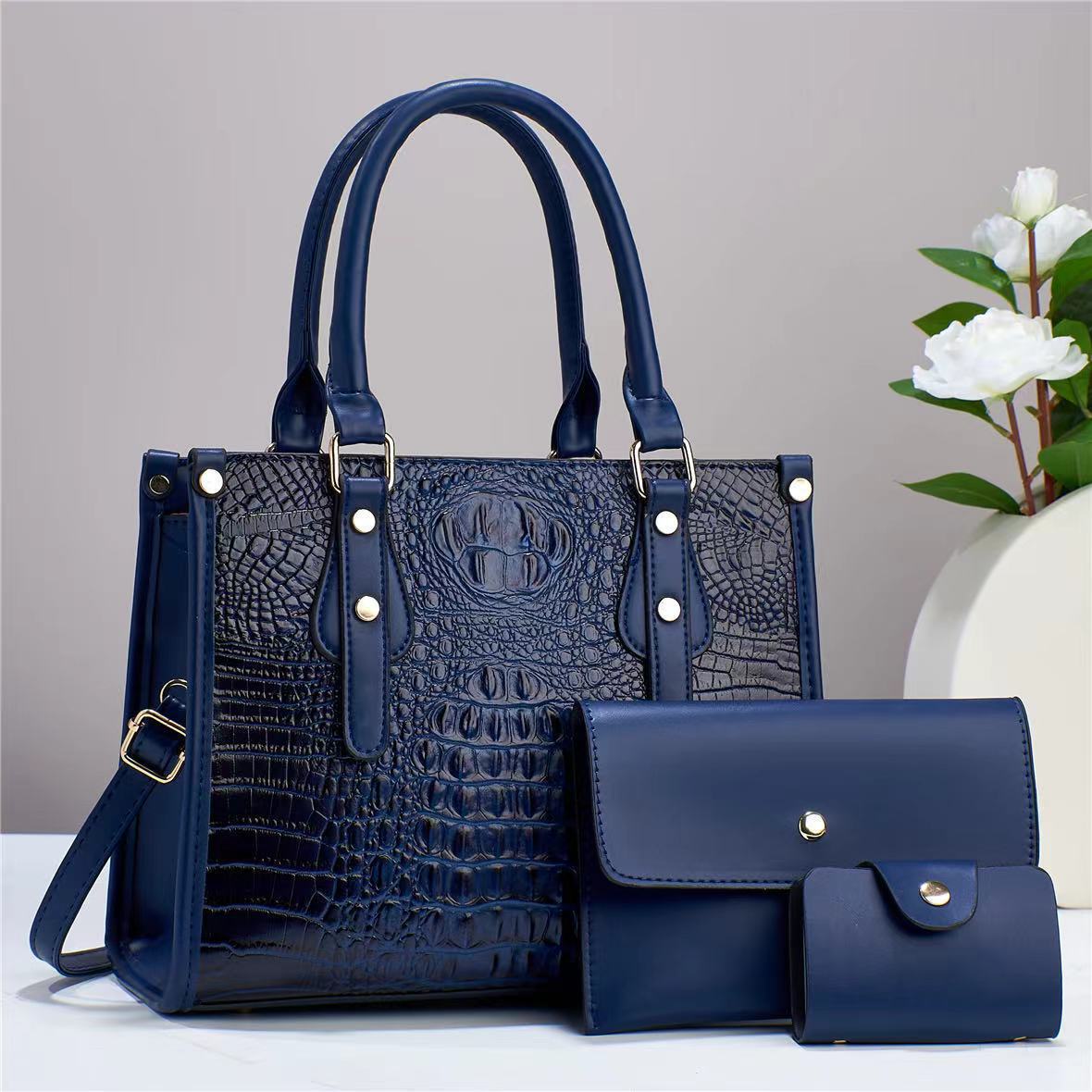 Bolso de mujer de moda popular 2026 nuevo transfronterizo de tres piezas europeas y estadounidenses paquete de bolso de madre para mujeres de viaje universal mochila de hombro