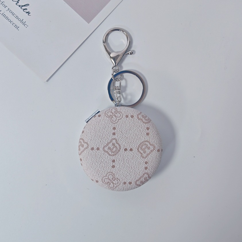 Bolsa de espejo popular en línea colgante de lujo ligero llavero portátil espejo de maquillaje transfronterizo colgante de bolsas de espejo doble cara