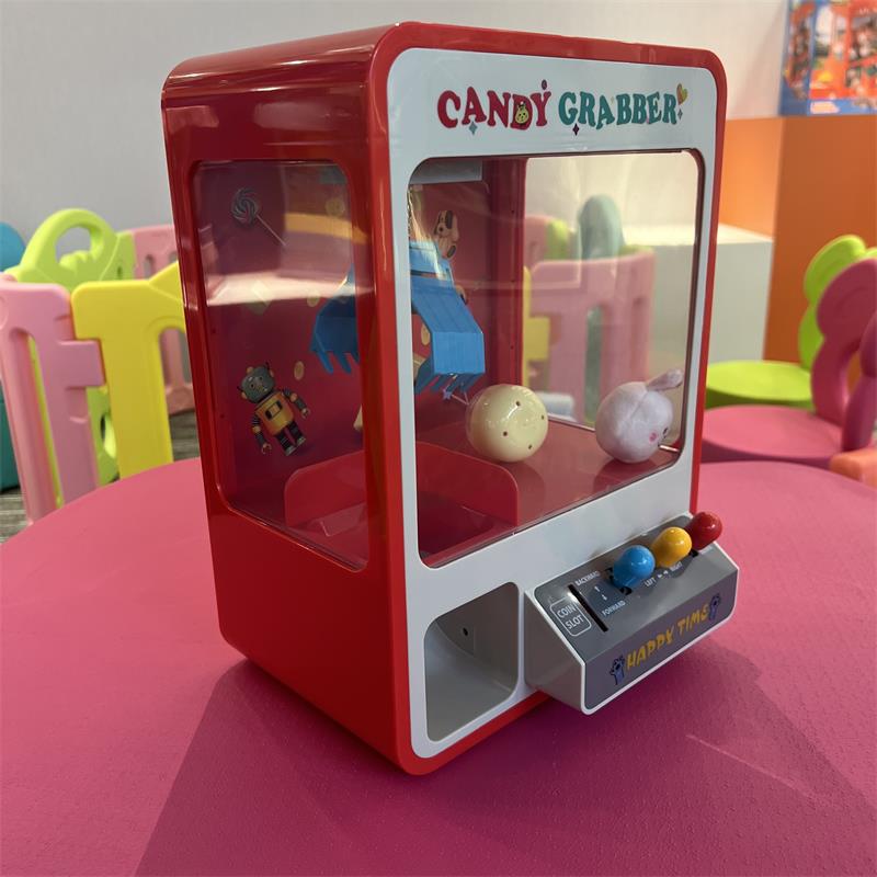 Máquina de agarre de muñeca para niños 959 muñeca que funciona con monedas pequeño hogar huevo torcer caramelo máquina de muñeca para niños eléctrica