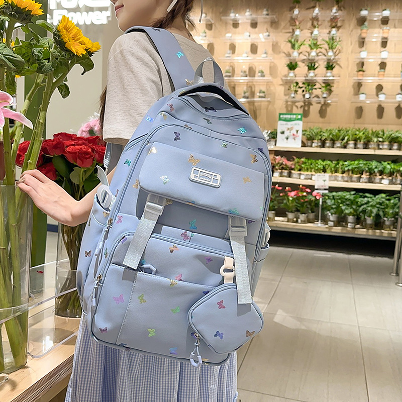 Cute mochila de gran capacidad nueva mochila de estudiantes de viajes de secundaria y secundaria de alto valor de la cara mochila de hombro de estudiantes en venta caliente