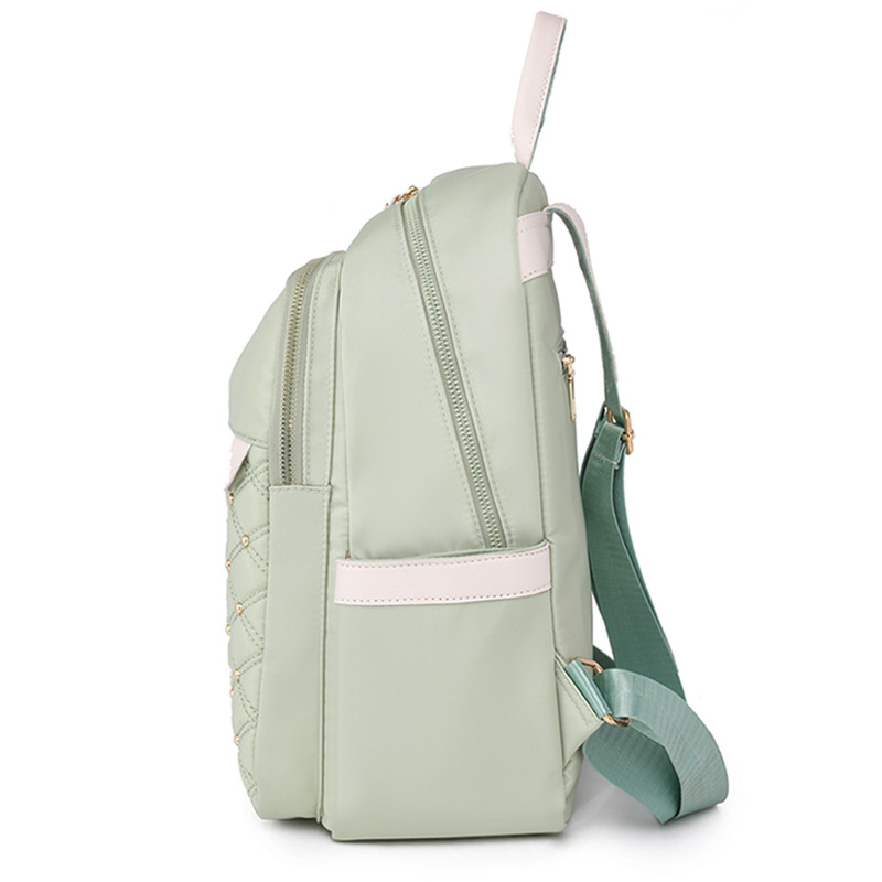 Bolsos para mujer 2023 nueva mochila de nailon para mujer coreana moda contraste color remache mochila de viaje mochila escolar en nombre del cabello