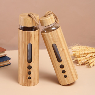 Factory direct supply bamboo shell heat-resistant high borosilicate glass simple modern handle cap glass bottle wholesale