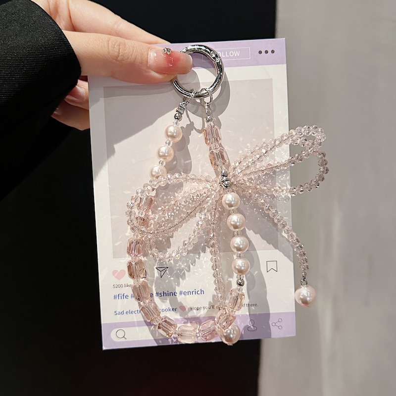 Boutique hecho a mano de alta gama para teléfono móvil cadena corta ins perla mariposa cordón de teléfono móvil de moda colgante de mensajero corto