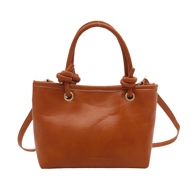 Bolso de moda simple 2024 invierno nuevo estilo retro textura bolso de cubo de moda color sólido viaje mochila de hombro