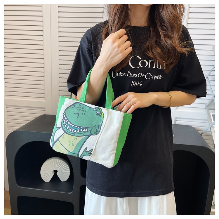 Cute cartoon printed small bag, 2024 summer new style hand-held piggy girl handbag, student storage canvas bag undefined