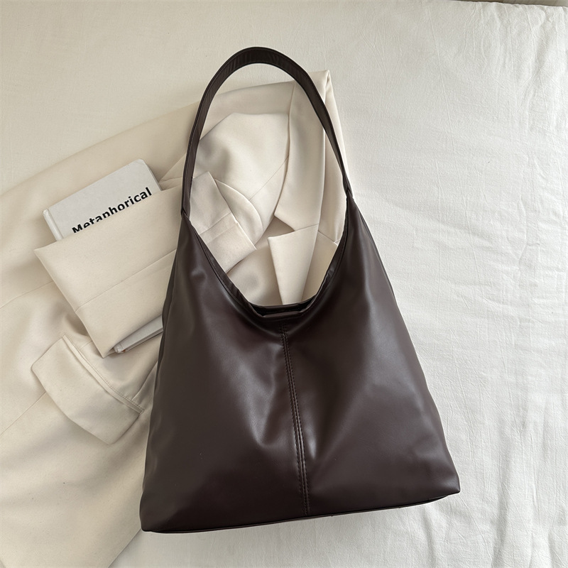 Bolsa de mujer de gran capacidad, textura de 2024, nueva moda simple, bolsa de hombro universal, bolsa de brazo de viaje de color.