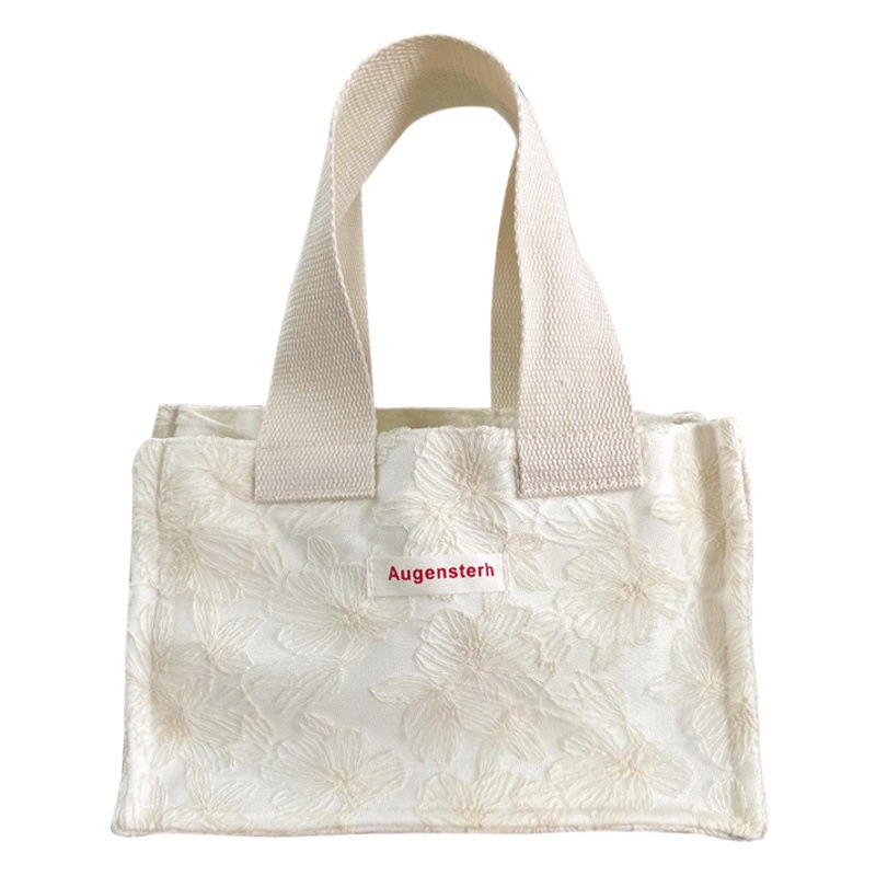 2023 new South Korea ins waterproof mini portable canvas all-match hand carrying out portable storage bag hand bag