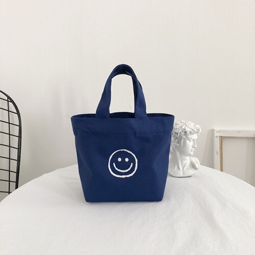 Korean Version 2025 New Smiling Face Ins Style Super Hot Canvas Bag for Girls Students Bento Mini Handbag Wholesale