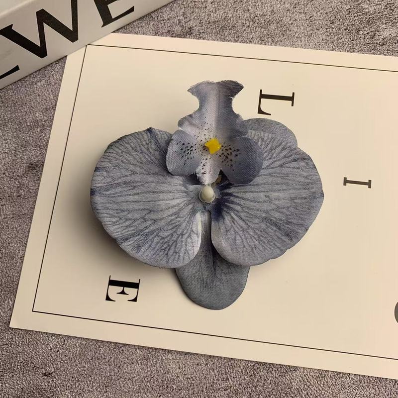 絹布の胡蝶蘭の花の頭は花の壁の部品の花の材料の頭をシミュレーションして髪を飾ってdiyの手作りの結婚祝いの贈り物を挟んで造花を飾ります。|undefined