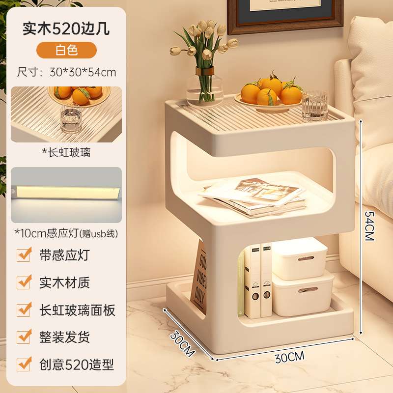 Sofá de lado unos pocos modernos y simples sala de estar casera pequeña mesa de té creativa cama de aire crema estante de cabecera