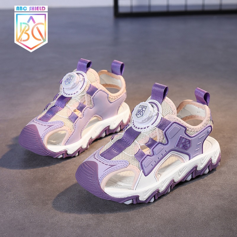 Sandalias para niñas Verano 2025 Sandalias antideslizantes de malla para niños Zapatos de playa Baotou Botón giratorio Sandalias para niños
