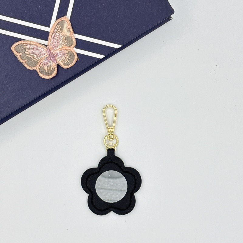 Flor espejo llavero cuero transfronterizo regalo colgante joyería creativo mini lápiz labial almacenamiento llavero colgante