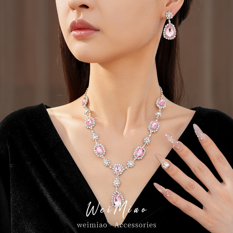 Collar de pendientes de gota de agua elíptica rosa ligero de lujo nicho cadena de clavícula temperamento delicado conjunto de joyas al por mayor