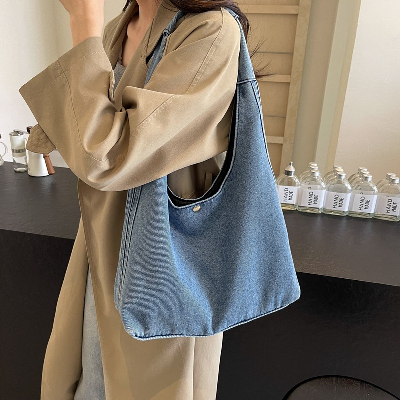 Bolso de mezclilla para mujer 2024 nuevo estilo estilo occidental bolso grande portátil de moda estilo perezoso casual todo fósforo bolso de axila de un solo hombro