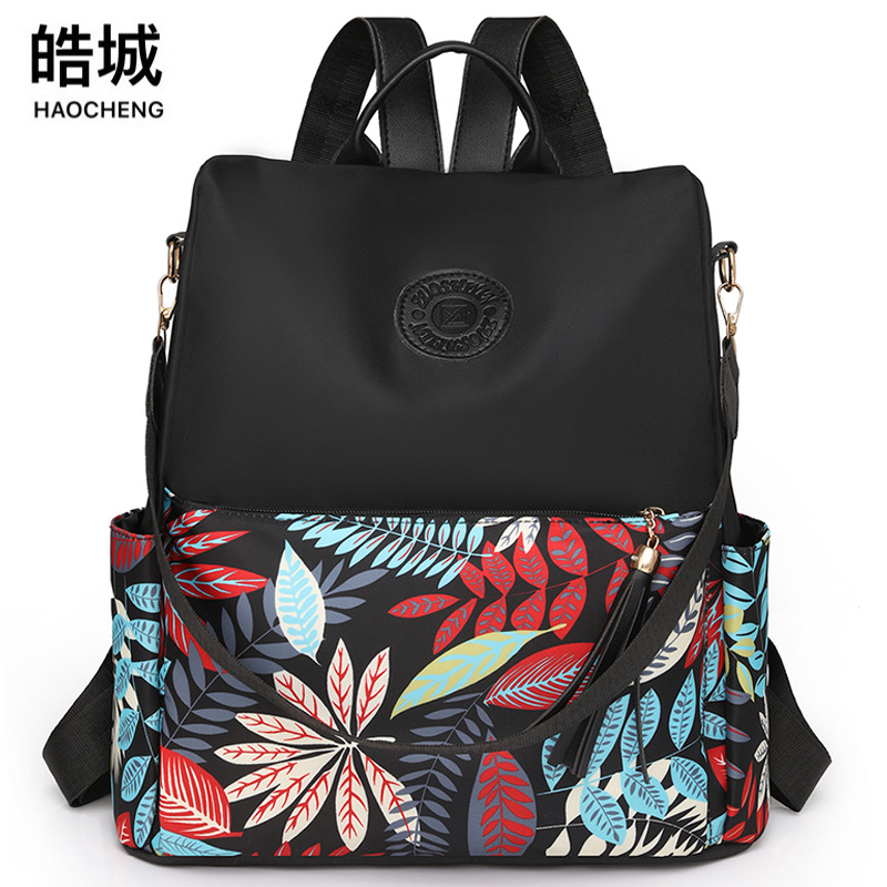 Comercio exterior al por mayor 2023 nueva mochila antirrobo de nailon para mujer casual moda color multifunción mochila de doble uso