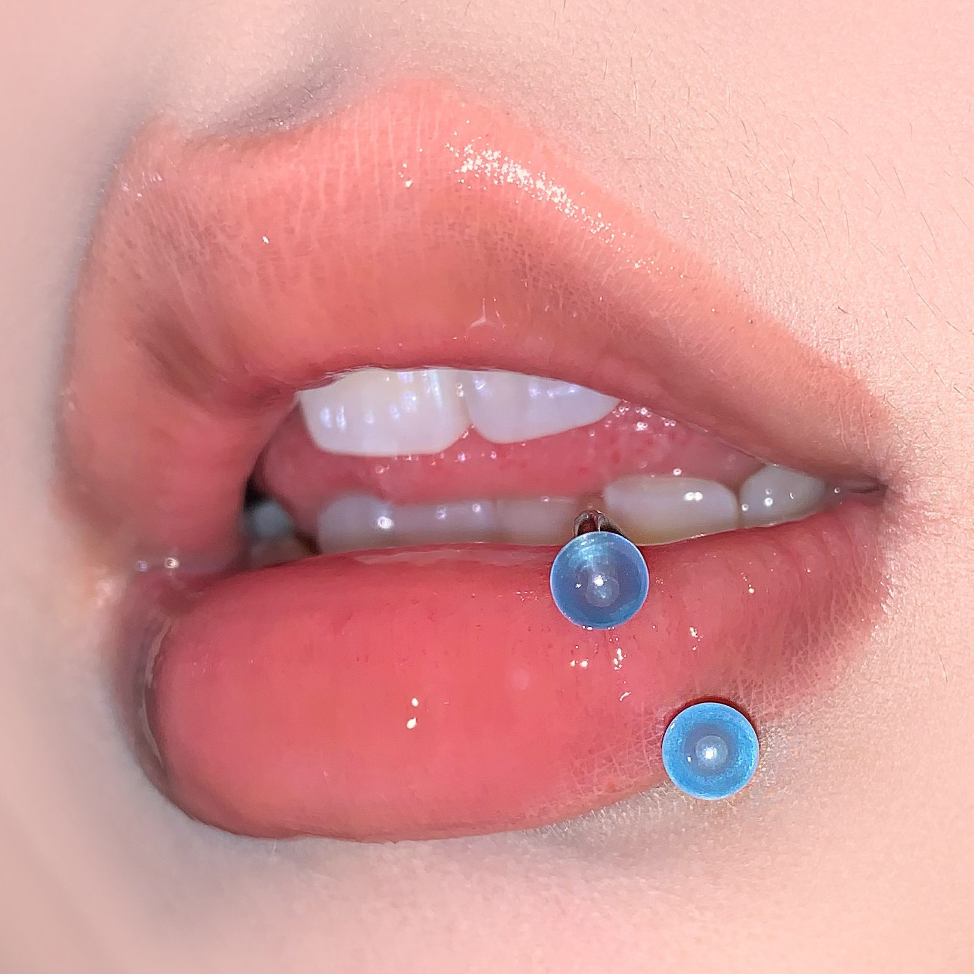 Silver pointed spike labret stud material detail