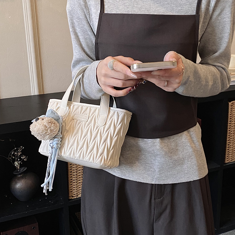 Coreano simple bolso de mano plegable de color sólido bordado de estilo extranjero bolso de hombro para hombres y mujeres nuevos accesorios para niños transfronterizos