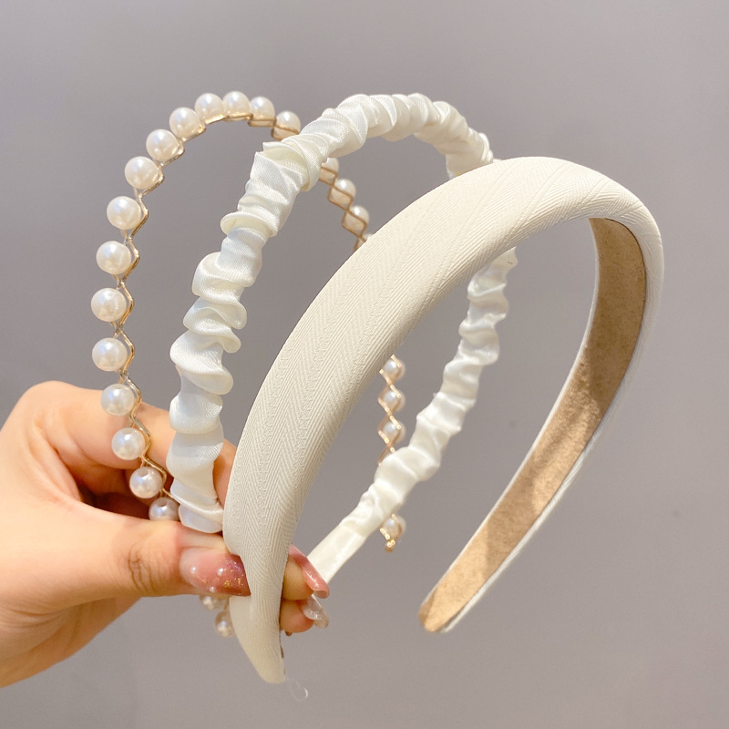 A principios de la primavera, la banda de cabello para mujeres en línea, 2025 nuevo lavado de cara de presión de tarjeta de cabello para el cabello, banda de cabello de perlas, banda de cabello para mujeres.