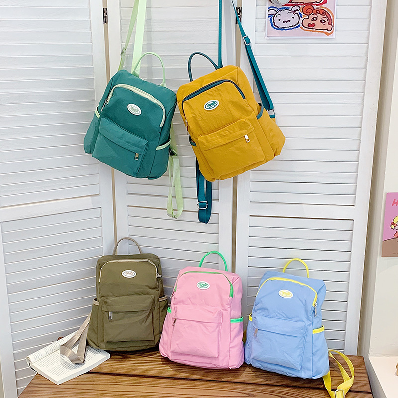 Mochila casual y sencilla para niños y niñas, estilo occidental, lindo color caramelo, mochila escolar para estudiantes de escuela primaria, nueva mochila para niños transfronteriza